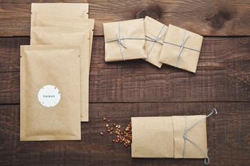 Paper bags with seeds for planting. Wooden table. View from above.