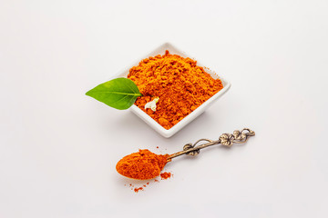 Hungarian hot paprika powder isolated on white background