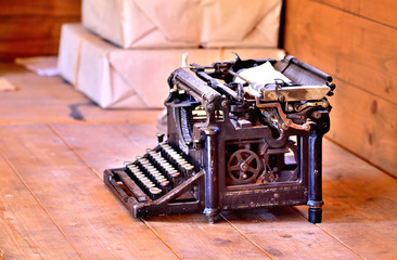 Old antique post typewriter from first world war in grunge looks on a wooden table