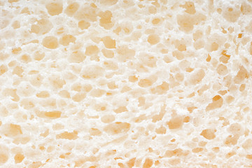 A slice of chopped wheat bread as a background, closeup