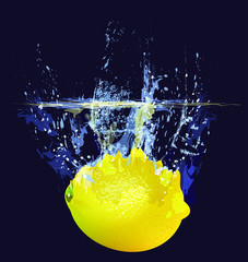 Lemon drops in clear water with splashes. Vector image.