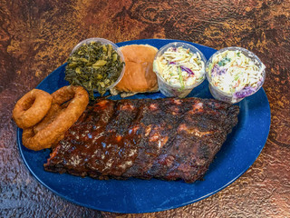 Barbecue platter on the table with meat and sides