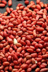 Peanuts in wooden bowl on rustic background