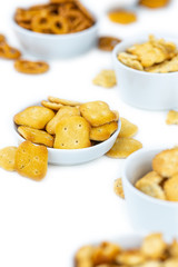 Mixed Snacks isolated on white (close up shot; selective focus)