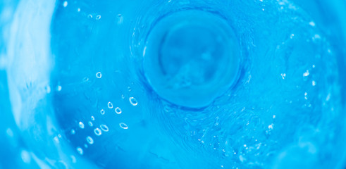 Horizontal abstract background with a stream of blue clear water