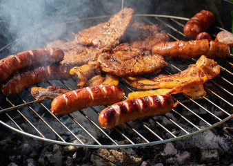 Unhealthy but tasty grilled sausages and meat