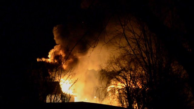 Big Fire of Two Houses Burning During the Night. Huge Flames.