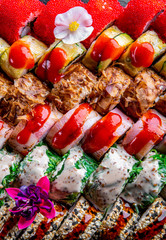 set of sushi roll with salmon, avocado, cream cheese, cucumber, tuna, rice, caviar, eel