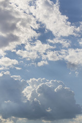 Naklejka na ściany i meble White clouds texture blue sky vertical background
