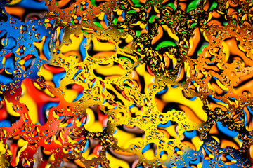 Fototapeta na wymiar colorful water drops on glass 