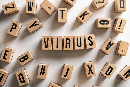 " virus " text made of wooden cube on  White background with pile words.