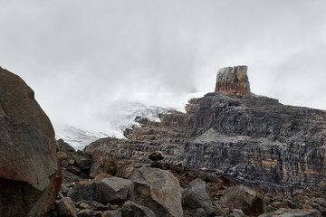 High mountain landscape with rough snowy cliffs, clouds passing by in the Andes, Sierra Nevada del Cocuy, Pulpito del Diablo, the Devil's Pulpit