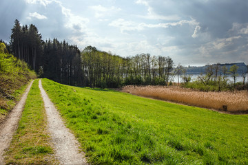 Spring landscape of a bavarian village with views of the forest and mountains