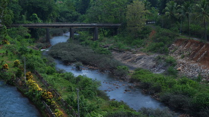 Fototapeta premium LONG RIVER CROSSING BRIDGE IN BEAUTIFUL LANDSCAPE