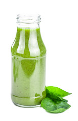 Homemade spinach smoothie isolated on white (close up; selective focus)