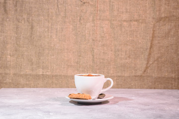 Cramped chocolate with nuts and cookies close-up. Tasty drink.
