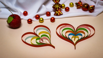 Colored paper strips for quilling. Valentine's Day decorations made from paper.