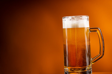 mug of beer on dark background