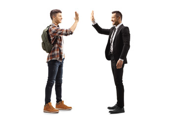 Male student gesturing high-five with a businessman