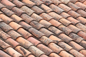 Roof with old stained tiles
