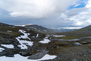 Endles mountain range covered in snow in Lapland, northern Sweden. View when hiking the Kings Trail in the swedish wilderness.