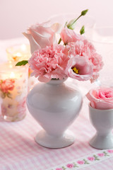 Beautiful bouquet in pink and white on the kitchen table