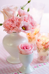 Beautiful bouquet in pink and white on the kitchen table