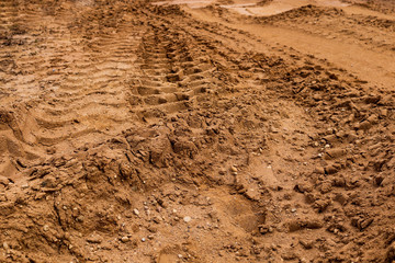 Many big car`s tyre prints in the sands