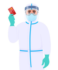 Person in safety protection suit, medical mask, glasses and face shield showing credit, debit, ATM card. Doctor or physician holding banking card. Surgeon wearing personal protective equipment (PPE).