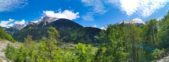 Panorama in canton Uri, Switzerland with swiss Alps and clouds