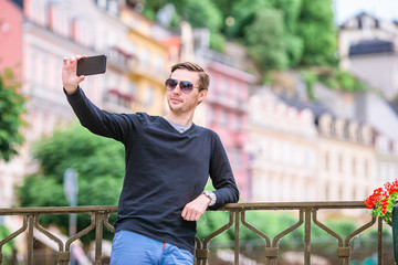 Man tourist outdoors in italian village on vacation