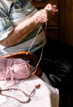 Polish Grandmother Still Remember How To Knit. Lilac Crewel And Rosary On The Table. 