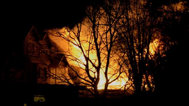 Big Fire of Two Houses Burning During the Night. Huge Flames.