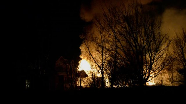 Big Fire of Two Houses Burning During the Night. Huge Flames.