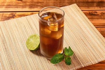 Mate tea in glass cup with ice and mint