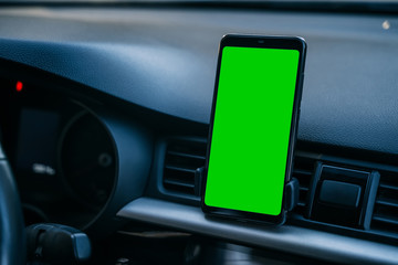 Obraz na płótnie Canvas Mobile phone in the car