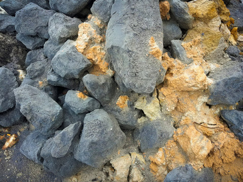 Titanium ore with silicon fragments. Photographed close-up. Horizontal frame.
