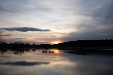 Evening landscape on the sunset lake