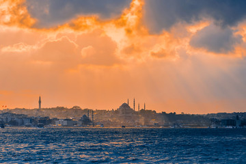 Fototapeta premium Istanbul at sunset, Turkey. A boat trip on the Bosphorus at sunset. Concept of nice traveling and vacation in Istanbul.