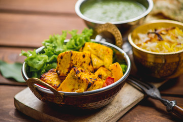 Traditional indian cuisine samosas  naan curry masala biryani rice kitchen towel panir tikka