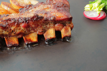 
grilled pork ribs with spices and vegetables