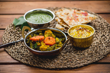Traditional indian cuisine samosas  naan curry masala biryani rice kitchen towel panir tikka