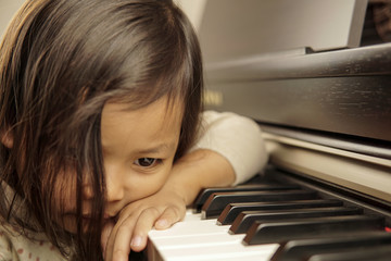 Little girl playing piano