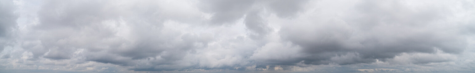 The stormy clouds on sunset panorama