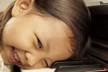 Little girl playing piano