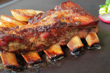 
grilled pork ribs with spices and vegetables