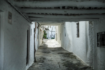 Fototapeta na wymiar White-walled passageway. Whitewashed.