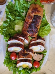 meatloaf with egg.  green salad and red cherry tomatoes