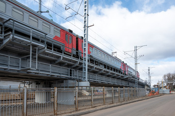 DC electric multiple units train ED4M-0343 on the flyover of track 2B at Reutovo station of Moscow Railway, Reutov, Moscow region, Russian Federation, March 22, 2020