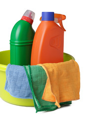 Cleaning supplies in basket and wipes for cleaning on white background